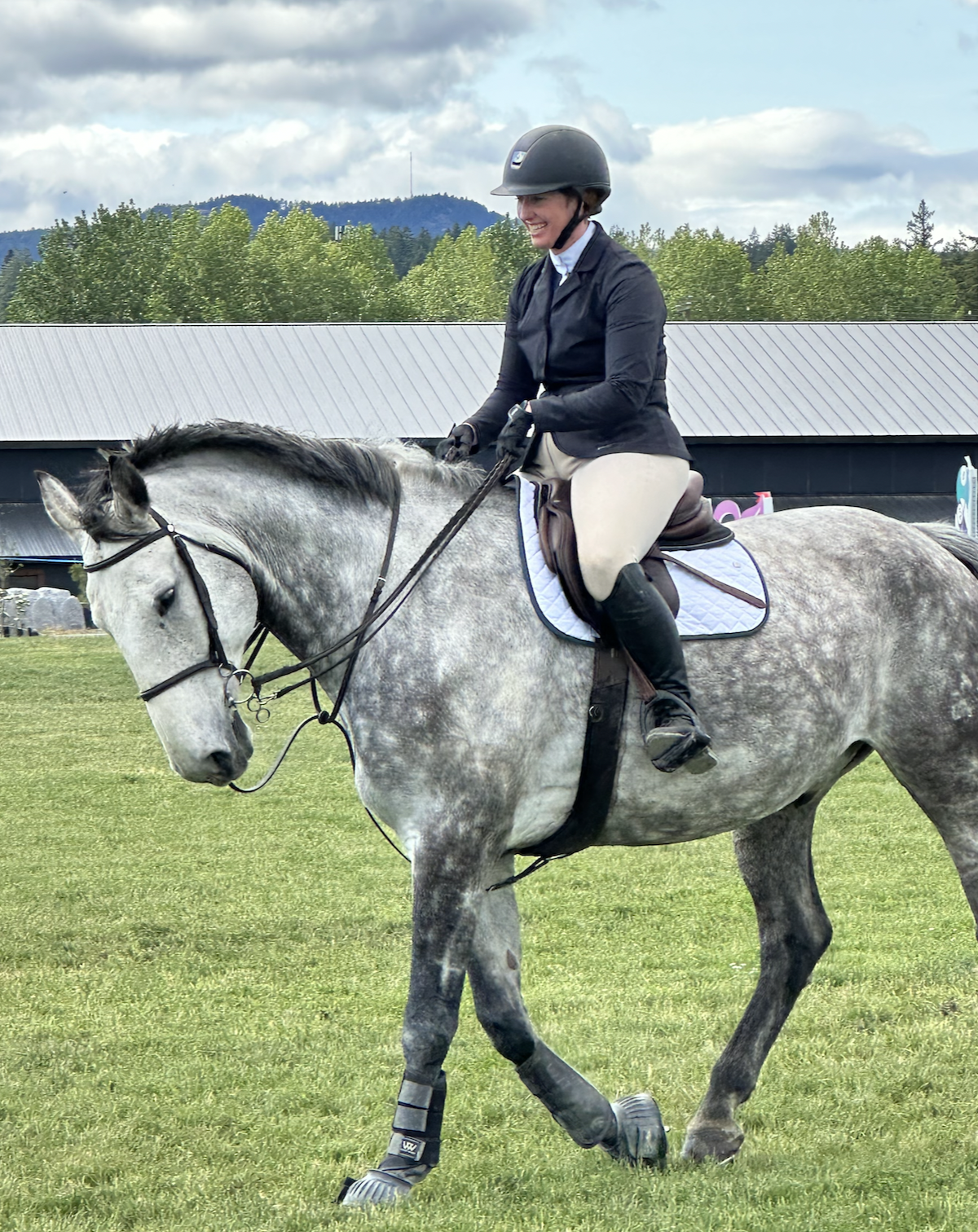 Kathryn Ballantyne riding her dapple grey horse